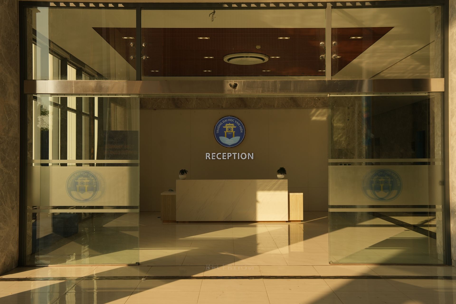 Office reception with the company logo on the wall