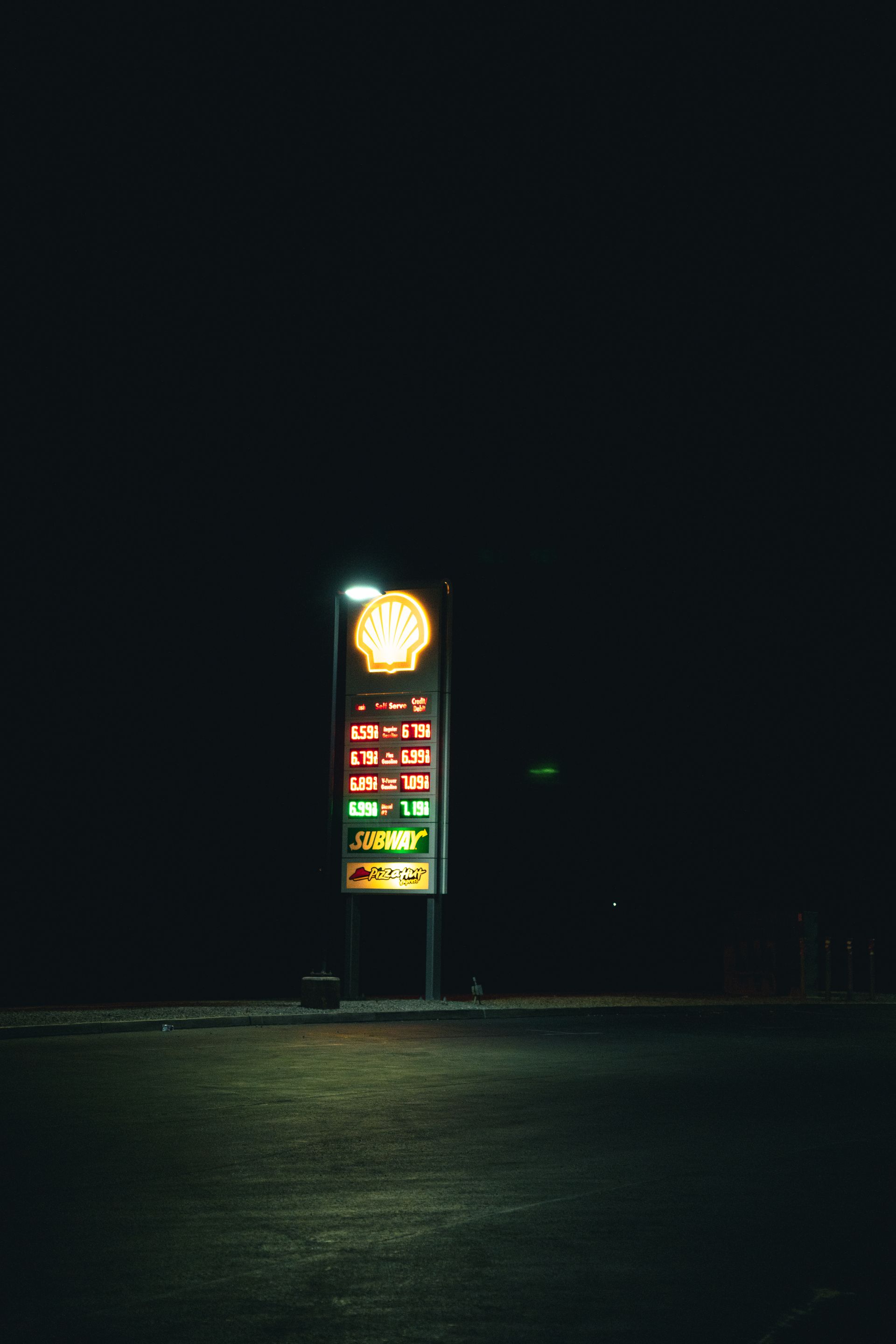 Single-brand pole sign glowing at night