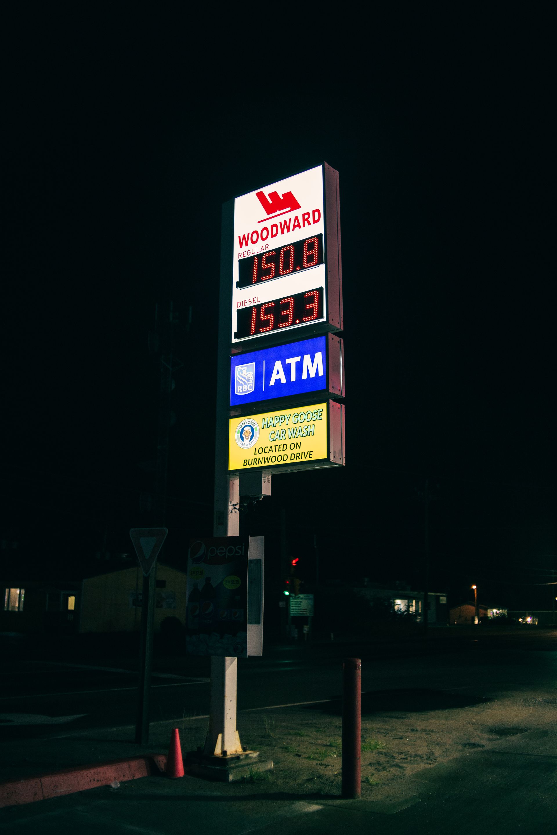 Pole sign with a lit price display