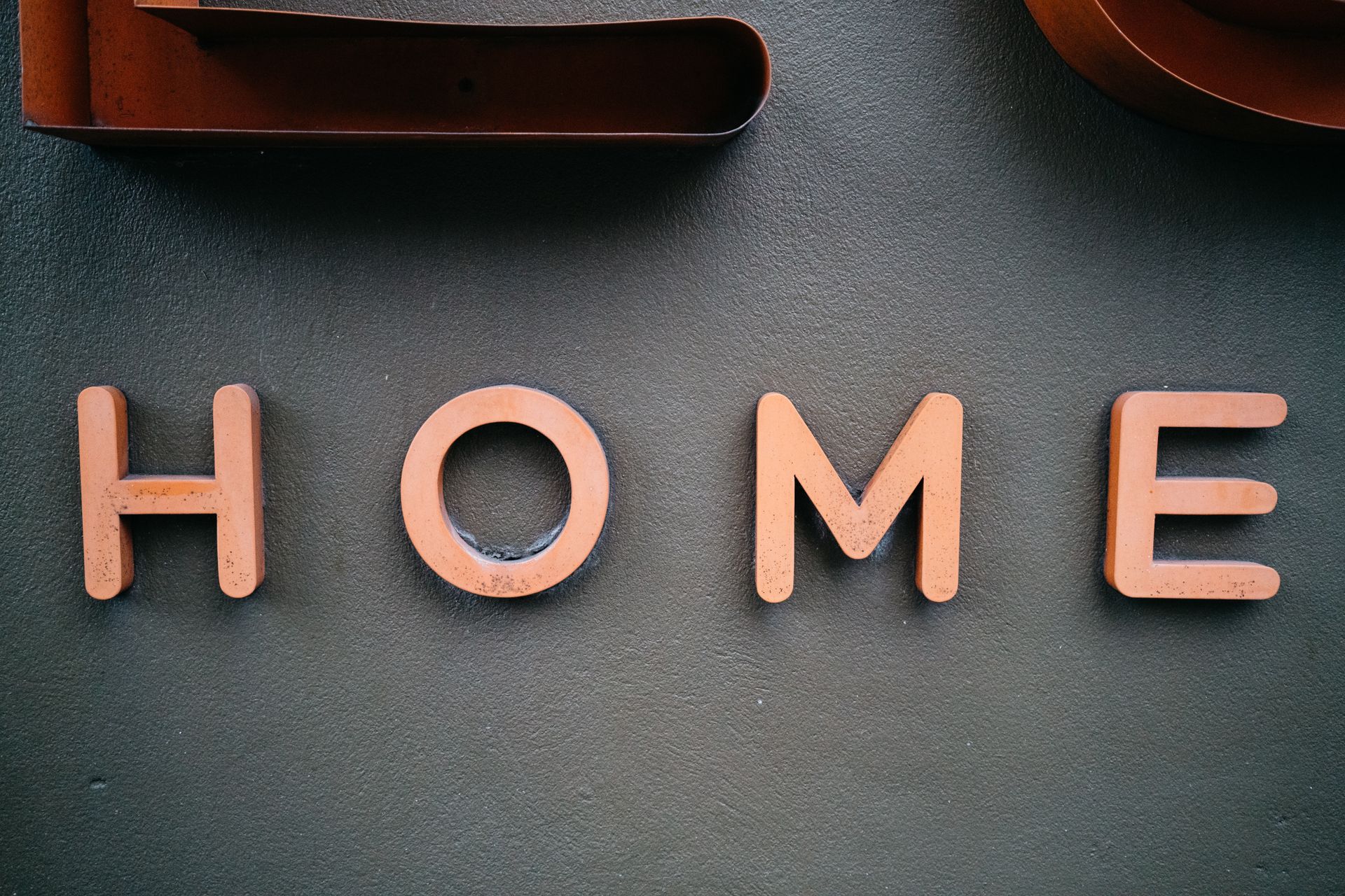 Painted letters on a grey wall