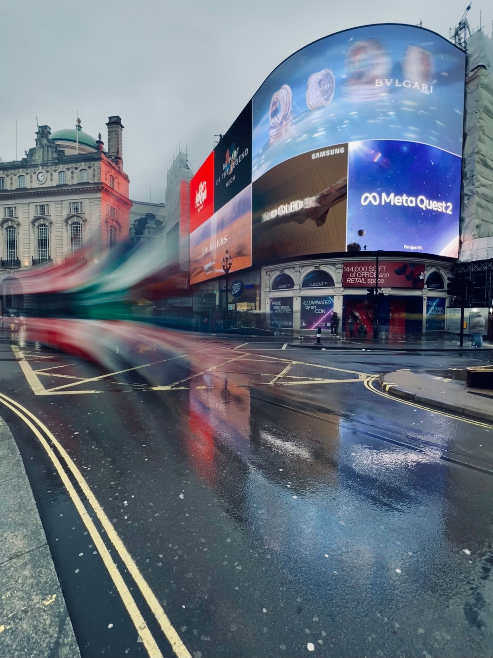 Digital billboards above a busy street
