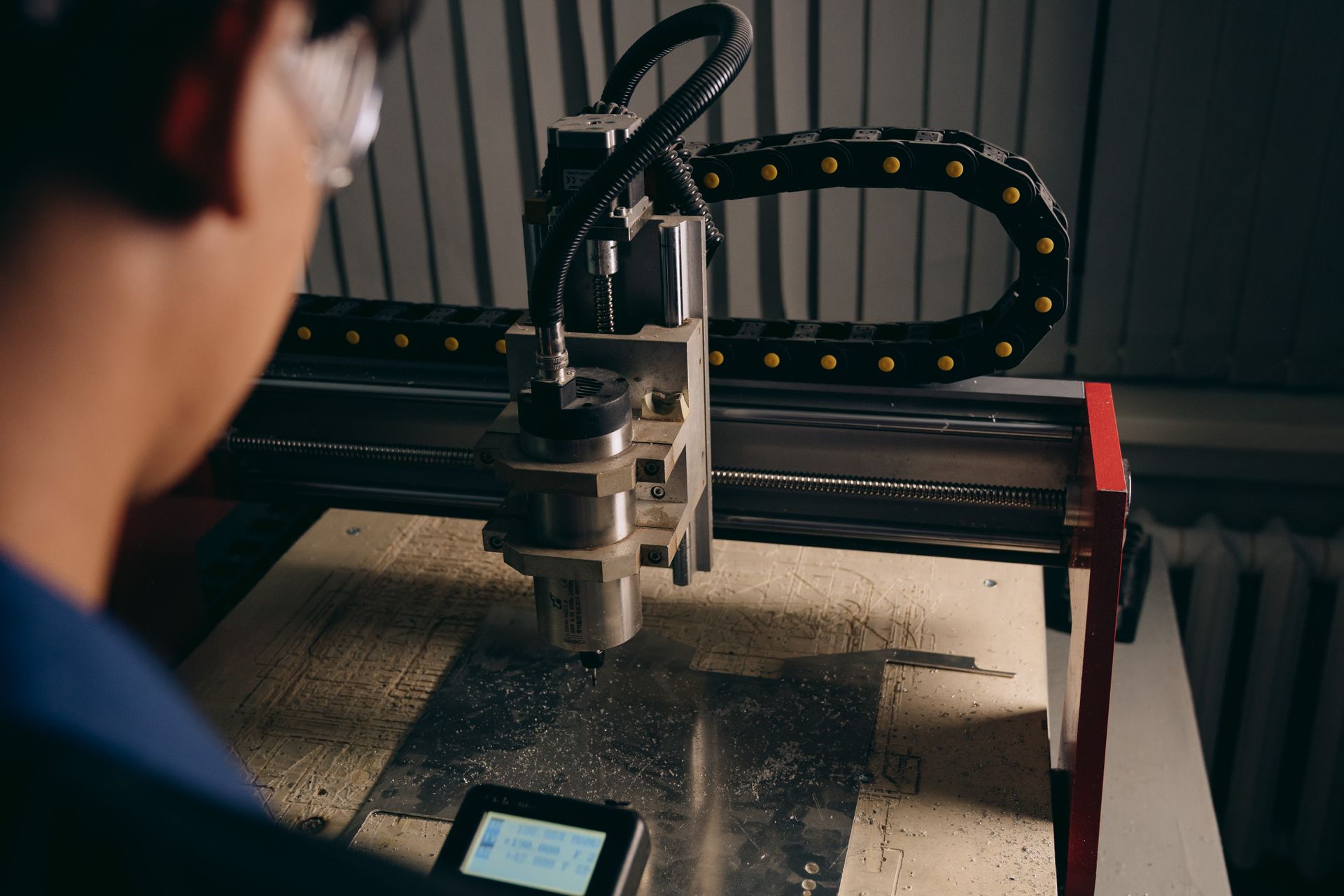 Technician at a CNC machine