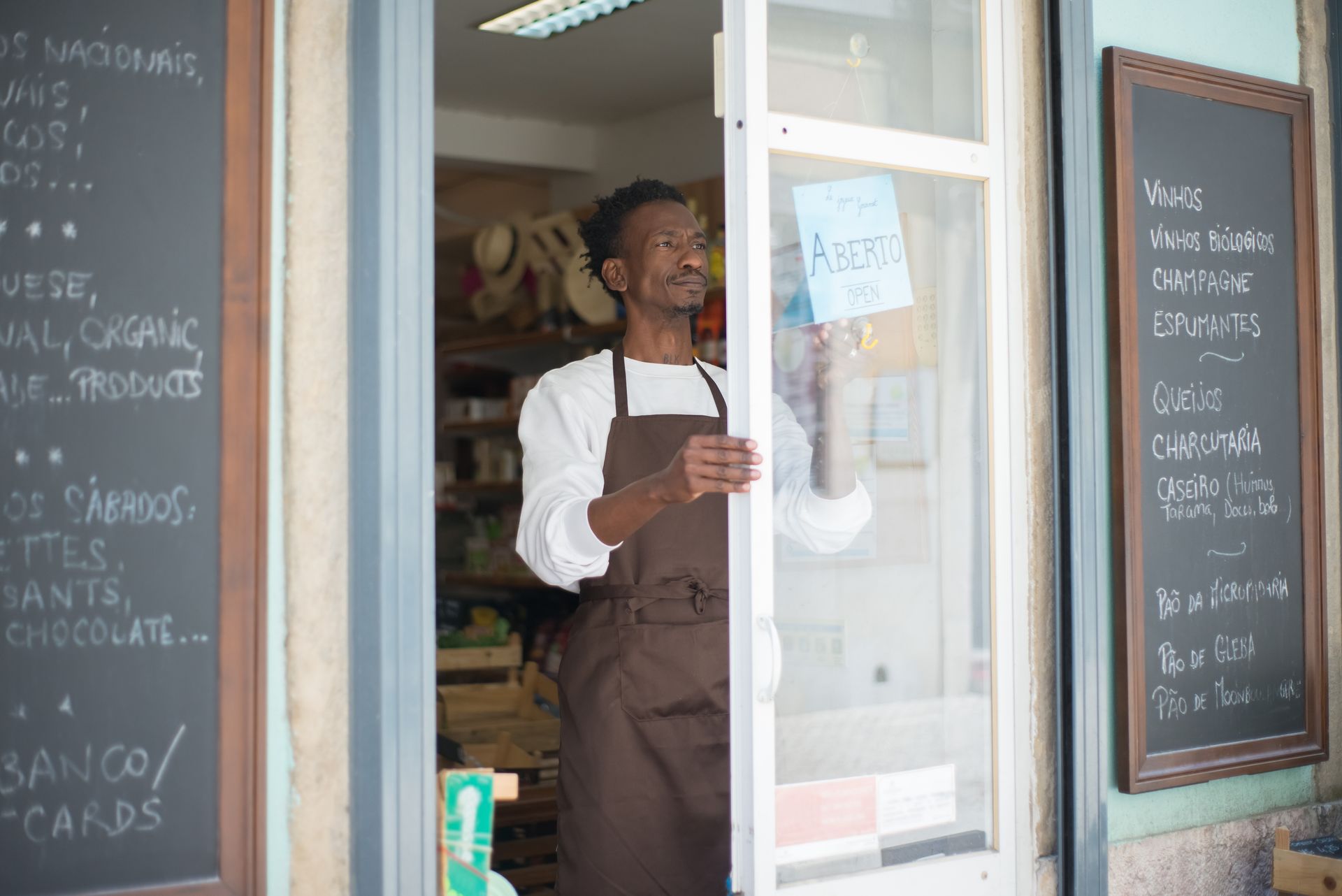 Shop owner opening the door for business