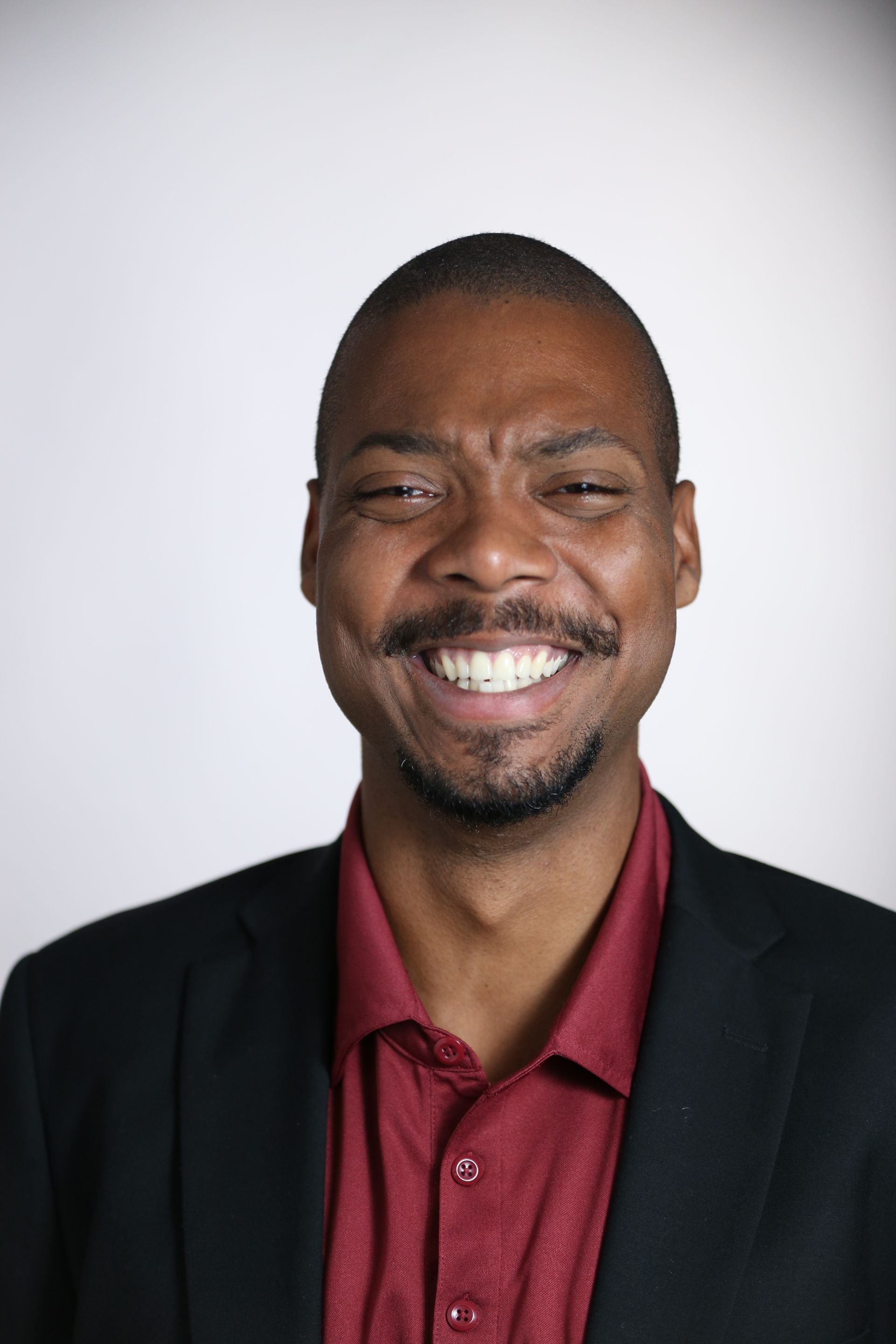 Portrait of a smiling man with a beard