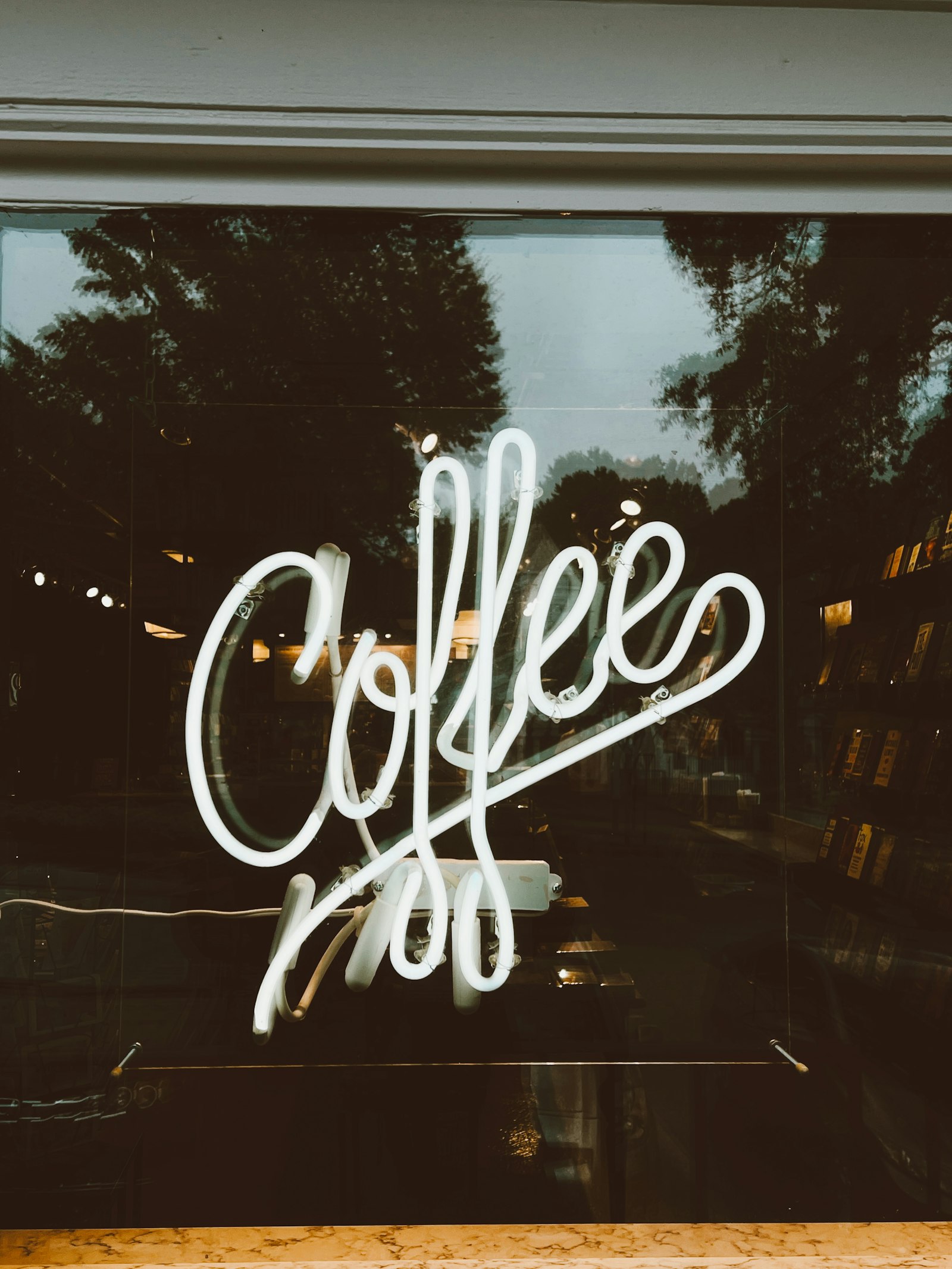 White neon sign in a shop window at night