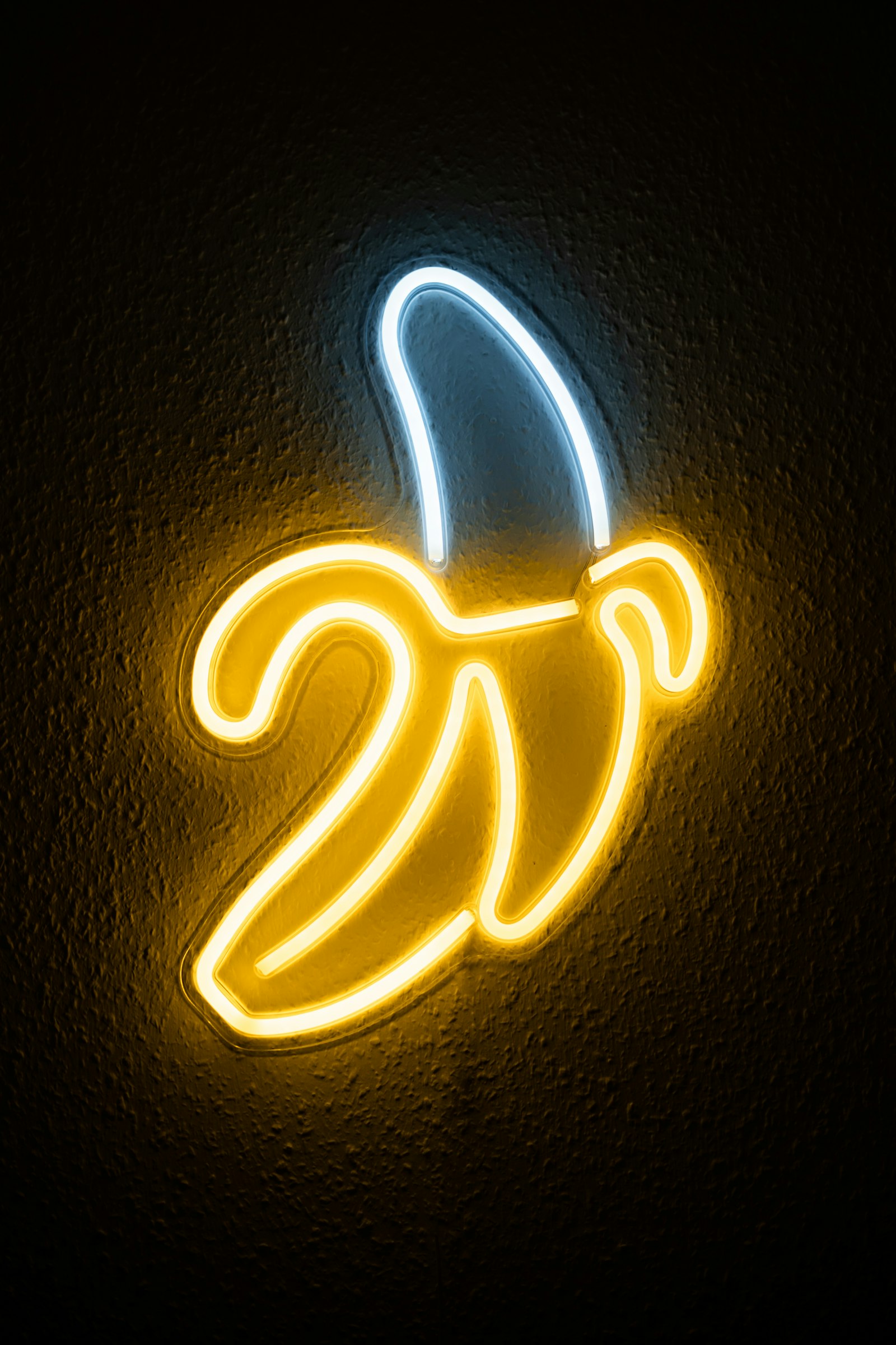 Yellow banana-shaped neon sign